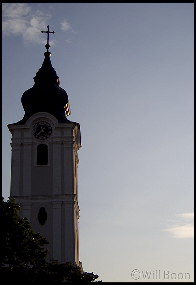 Early evening sunlight reflecting off a clock tower, Pecs